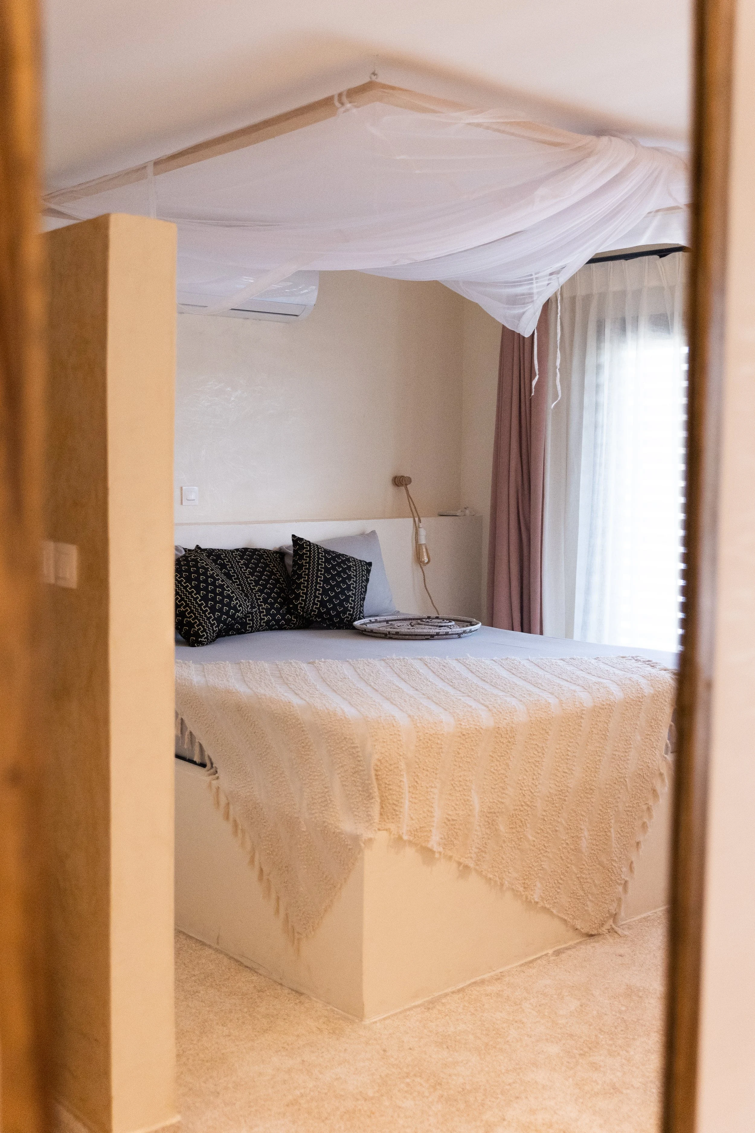 Suite avec lit baldaquin et moustiquaire
